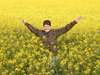 Ramona Rubach - playful in a field of canola in the Western Cape